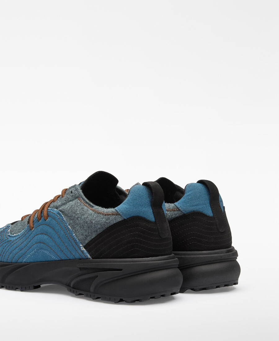 homme à baskets patchwork